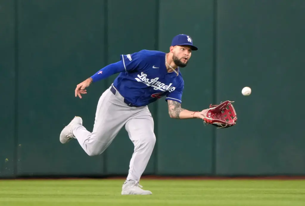 Dodgers center fielder Andy Pages catches a fly ball hit...
