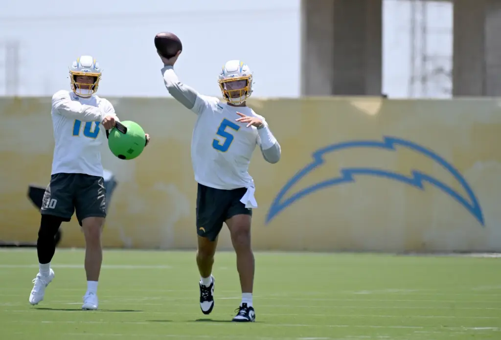 Chargers quarterbacks Justin Herbert (10) and Trey Lance (5) participate...