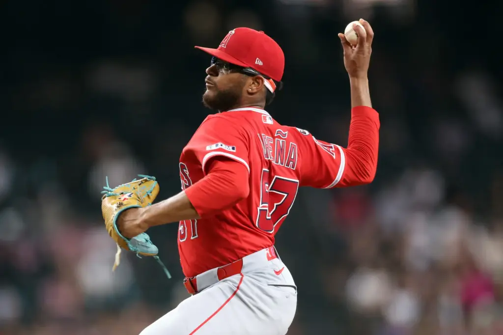 Angels starting pitcher Walbert UreÃ±a throws to the plate during...