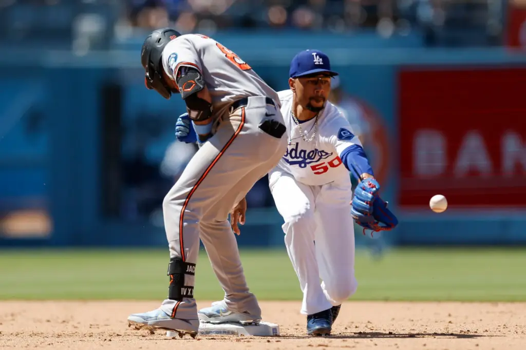 Baltimore Orioles’ Jeremiah Jackson, left, runs to second base as...