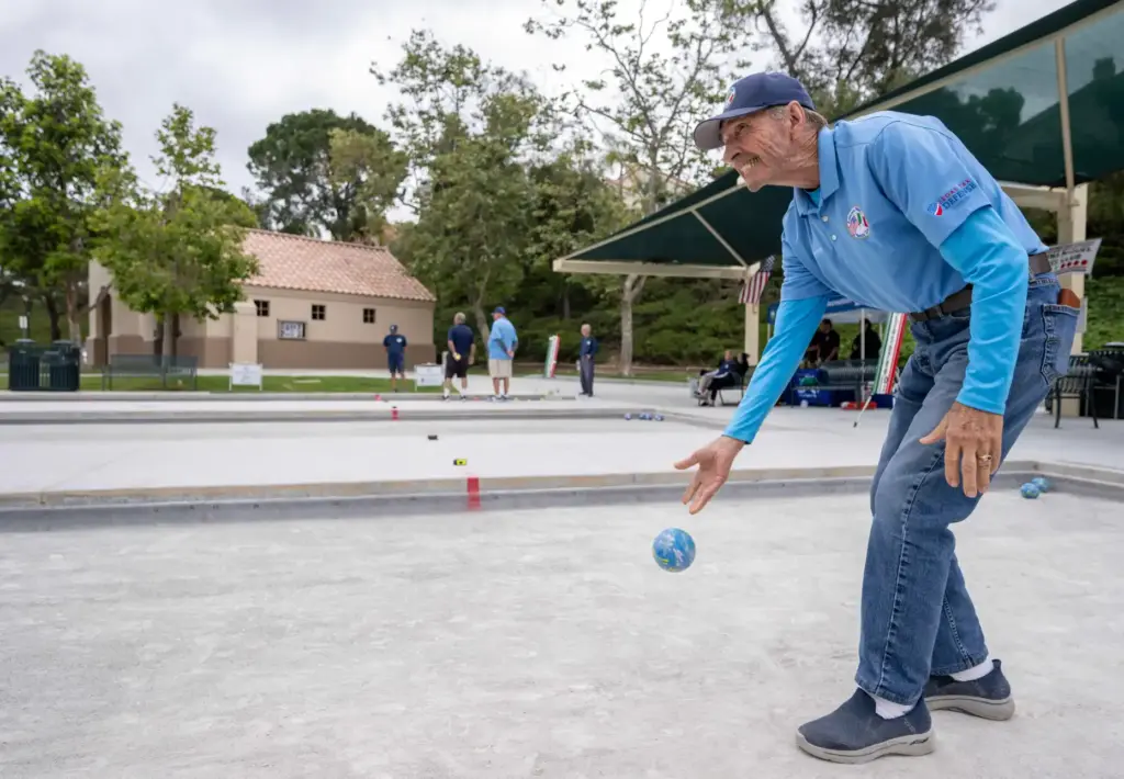 John Cummings of Laguna Niguel tosses a bocce ball while...