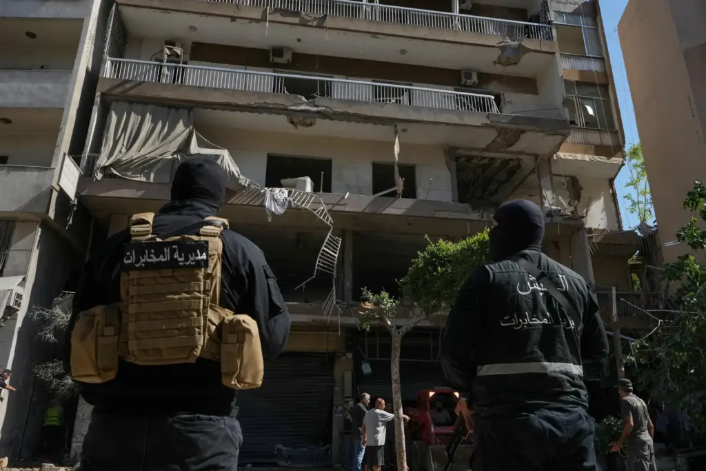 Members of the Lebanese Army Intelligence stand guard in front...