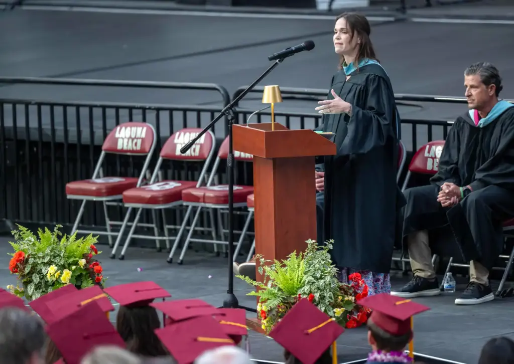 Laguna Beach High School teacher Caitlin Brady delivers the graduate...