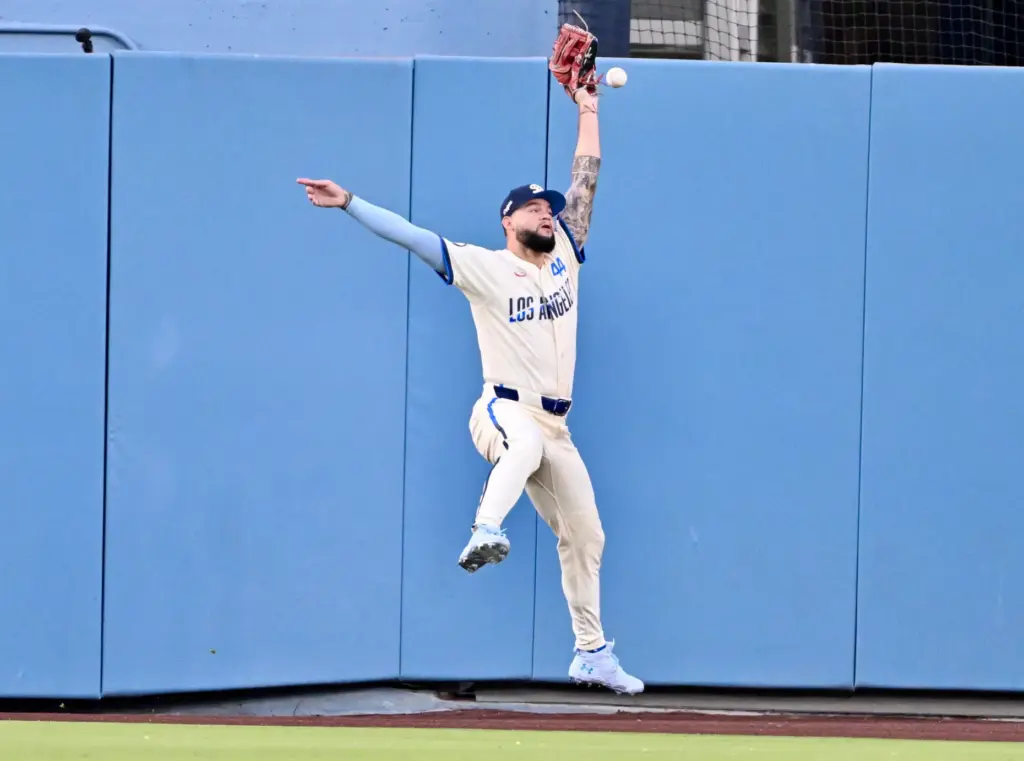 Oswald Peraza (not pictured) of the Angels triples over centerfielder...