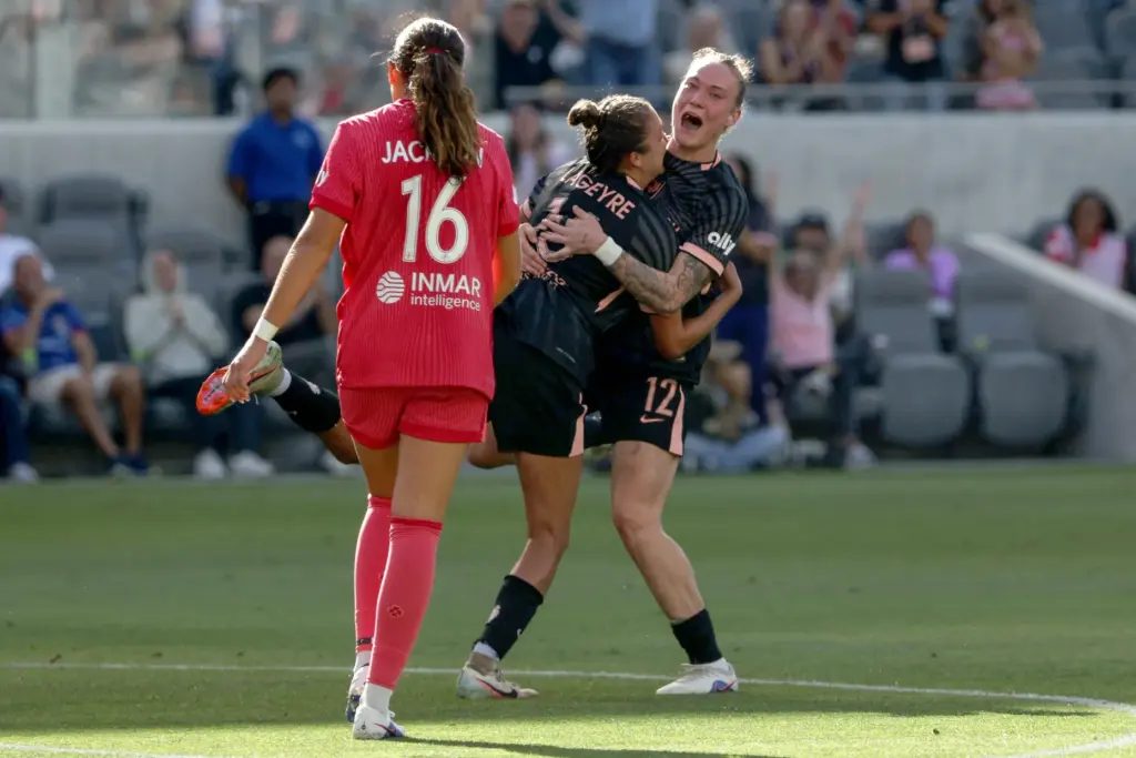 Angel City FC midfielder Maiara Niehues, right, celebrates with midfielder...