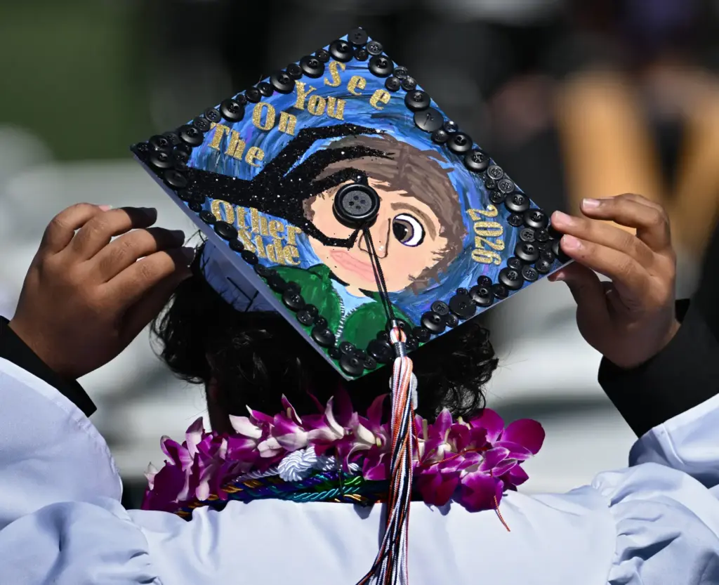 Huntington Beach High School graduates show their creativity by decorating...