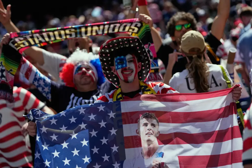 United States fans celebrate on the stands at the end...