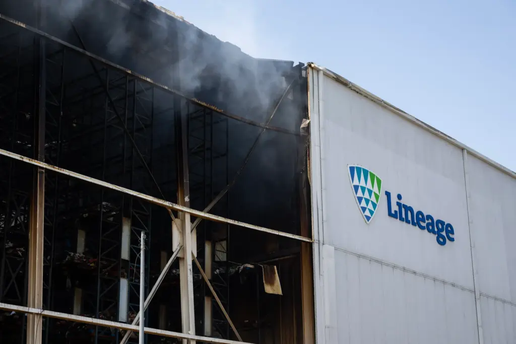 Smoke continues to spew from the Lineage Logistics warehouse in...