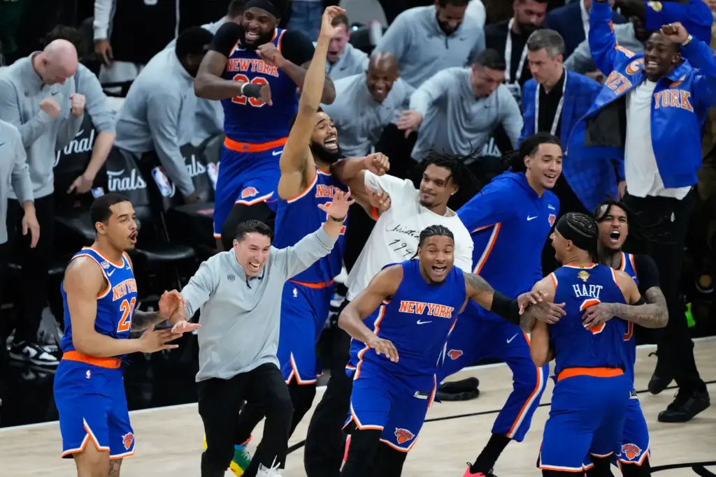 The New York Knicks celebrate after defeating the San Antonio...