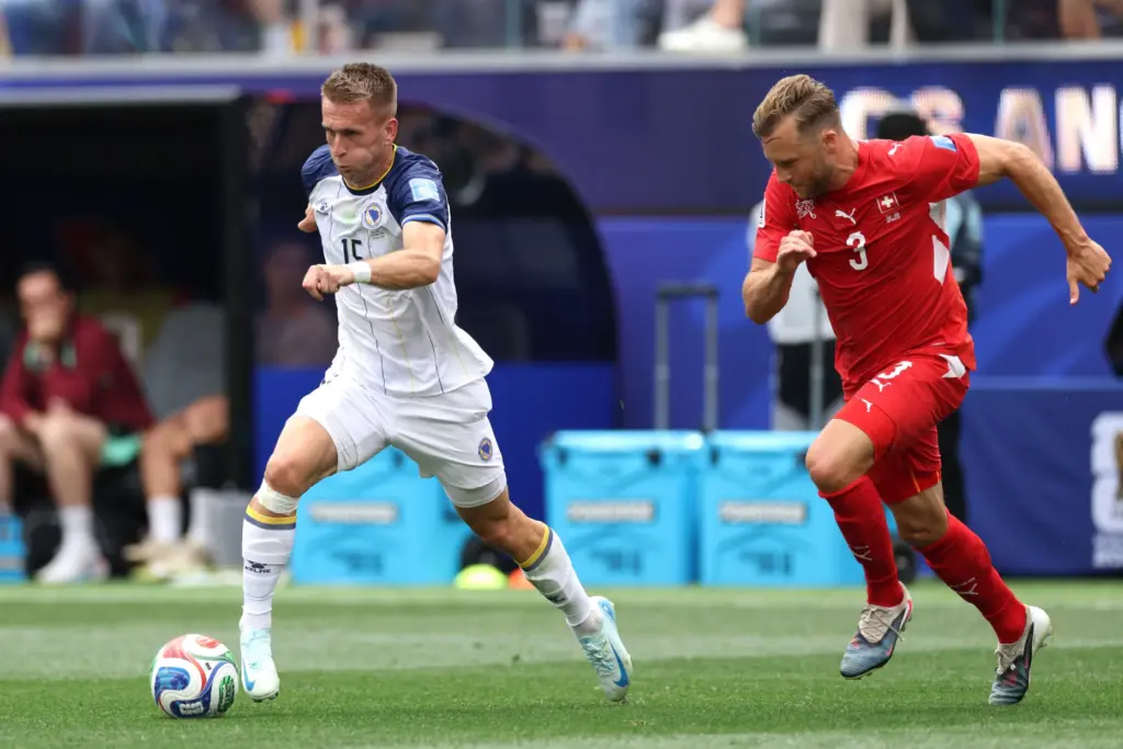 Bosnia and Herzegovina midfielder Amar MemiÄ (15) moves the ball...