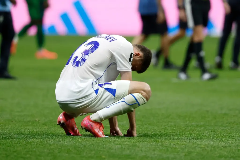 Uzbekistan’s Sherzod Nasrullaev (13) reacts to a loss during the...