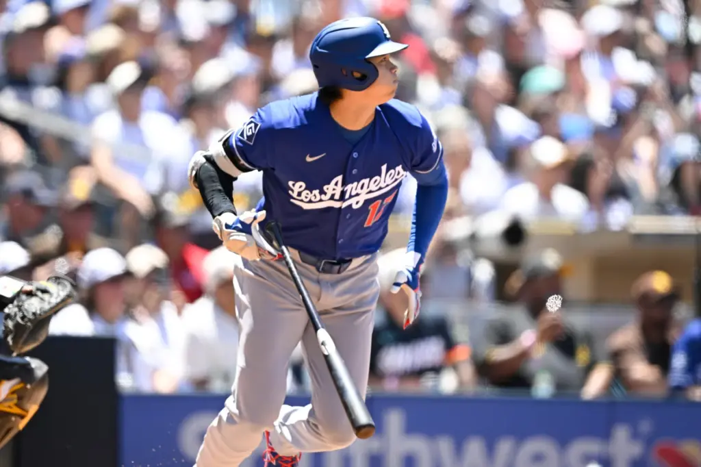 Dodgers designated hitter Shohei Ohtani watches his RBI single during...