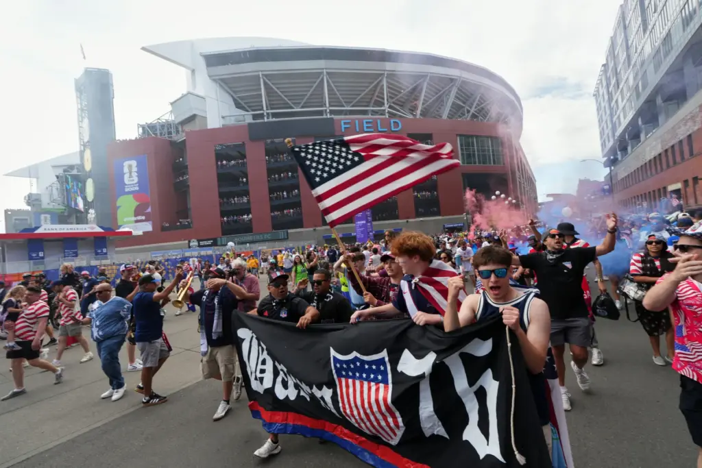 A group of United States fans arrive outside the stadium...
