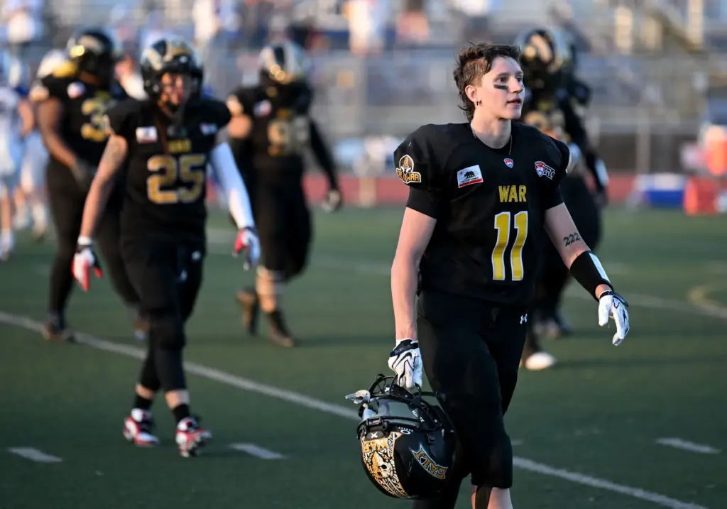 Cali War players walk off the field after losing a...