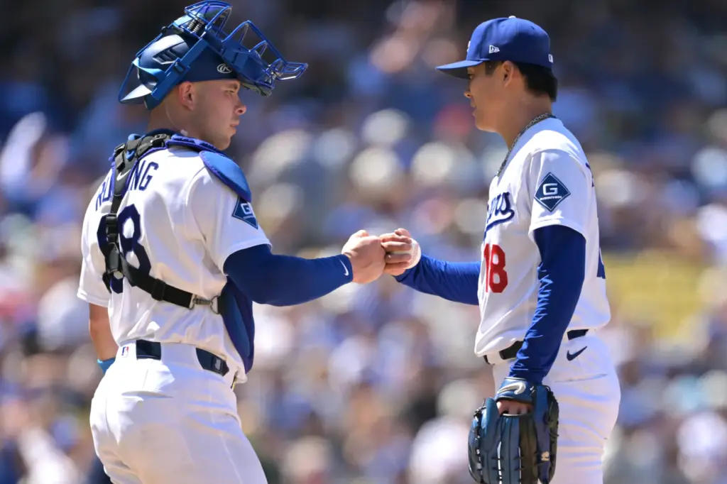 Dodgers catcher Dalton Rushing, left, congratulates Dodgers starting pitcher Yoshinobu...