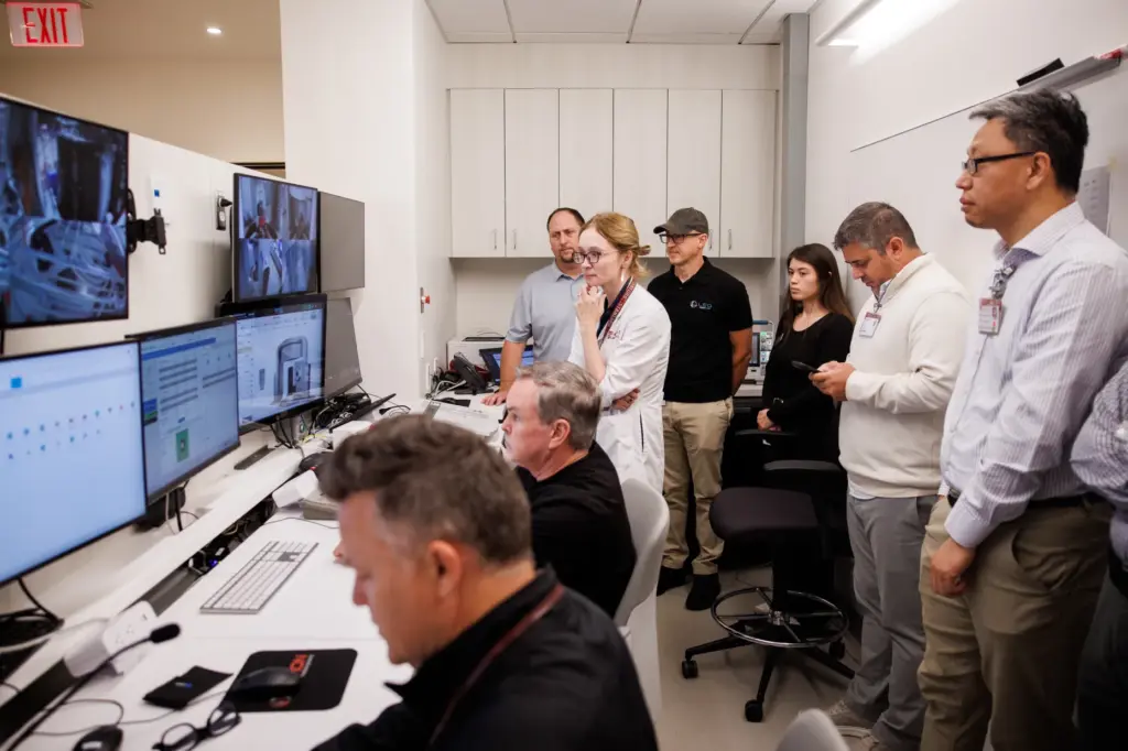 Stanford Medicine radiation oncologist Dr. Susan Hiniker, center, and staff...