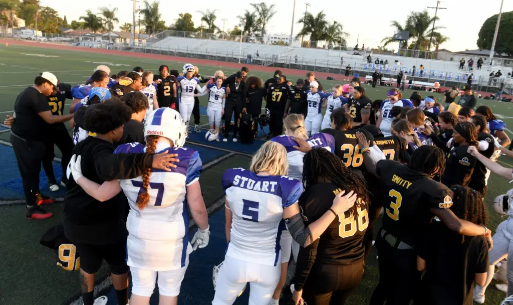 Cali War players congregate with the Salt Lake City Wildcats...
