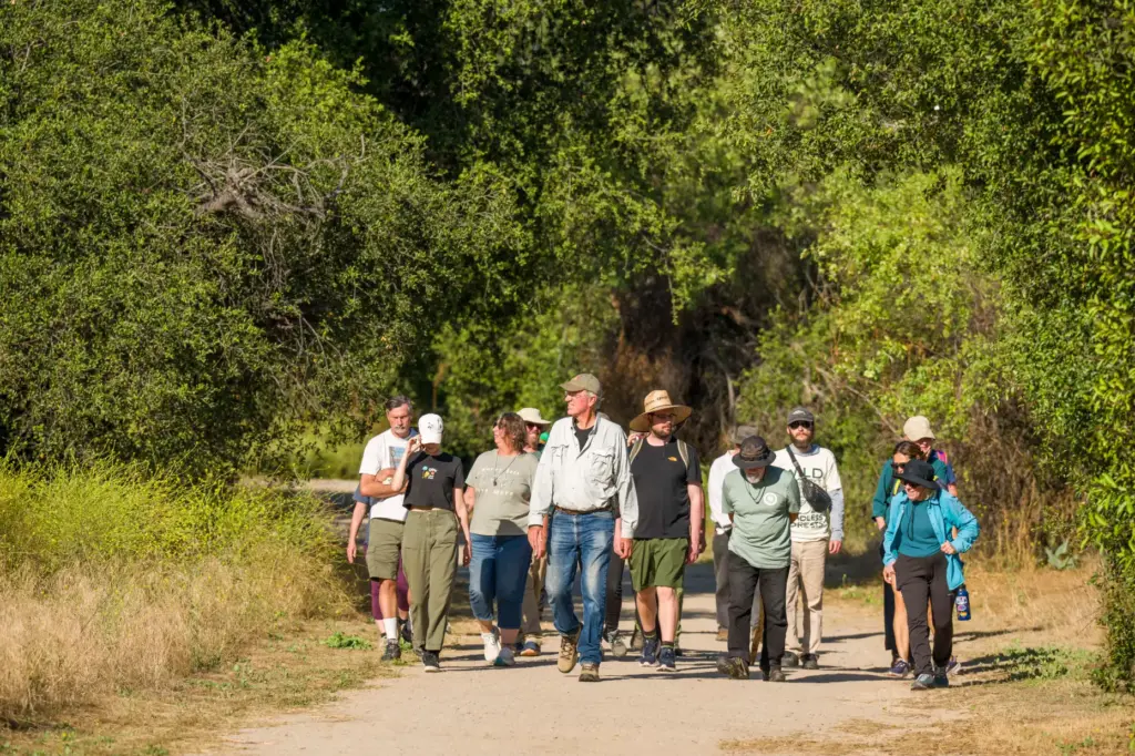 Ron Vanderhoff of the California Native Plant Society, center, leads...