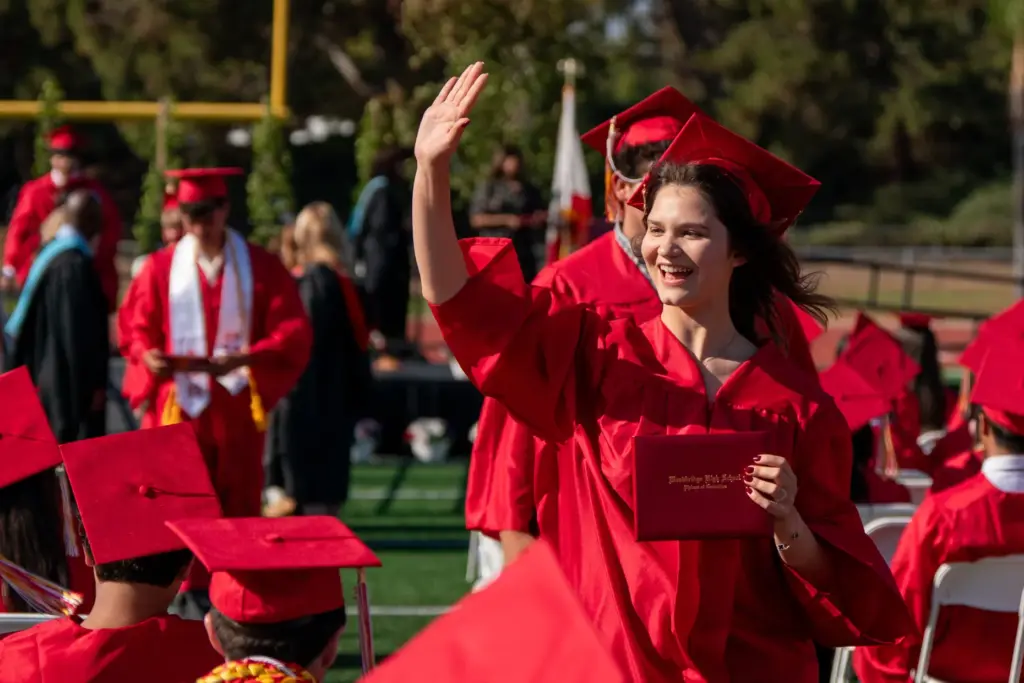 Oleksandra Strokina waves to her family during the Woodbridge High...