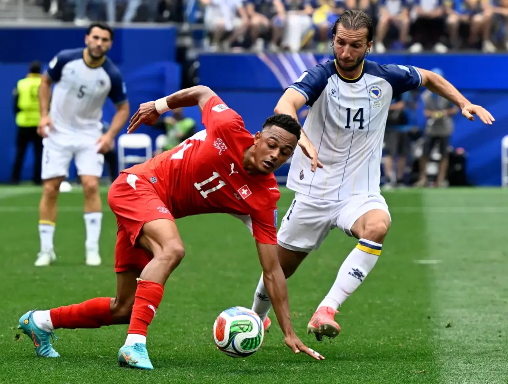 Switzerland forward Dan Ndoye (11) attempts to pass as Bosnia...