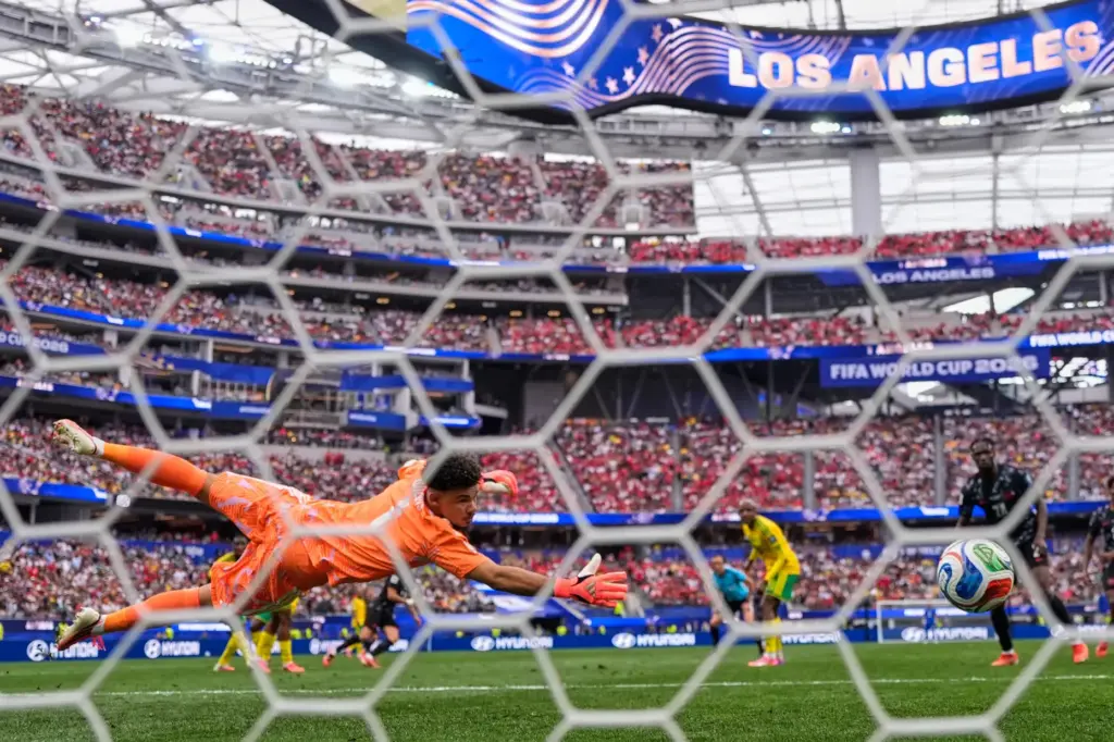 Canada’s Stephen Eustaquio (7) scores their opening goal past South...
