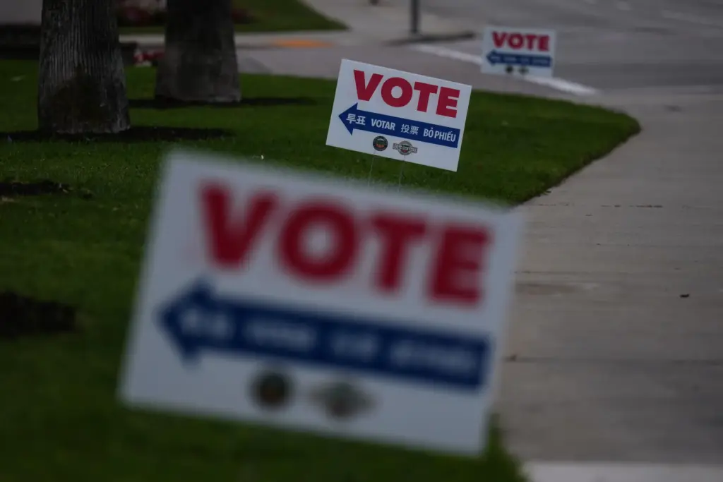 Vote signs are seen outside a vote center in La...