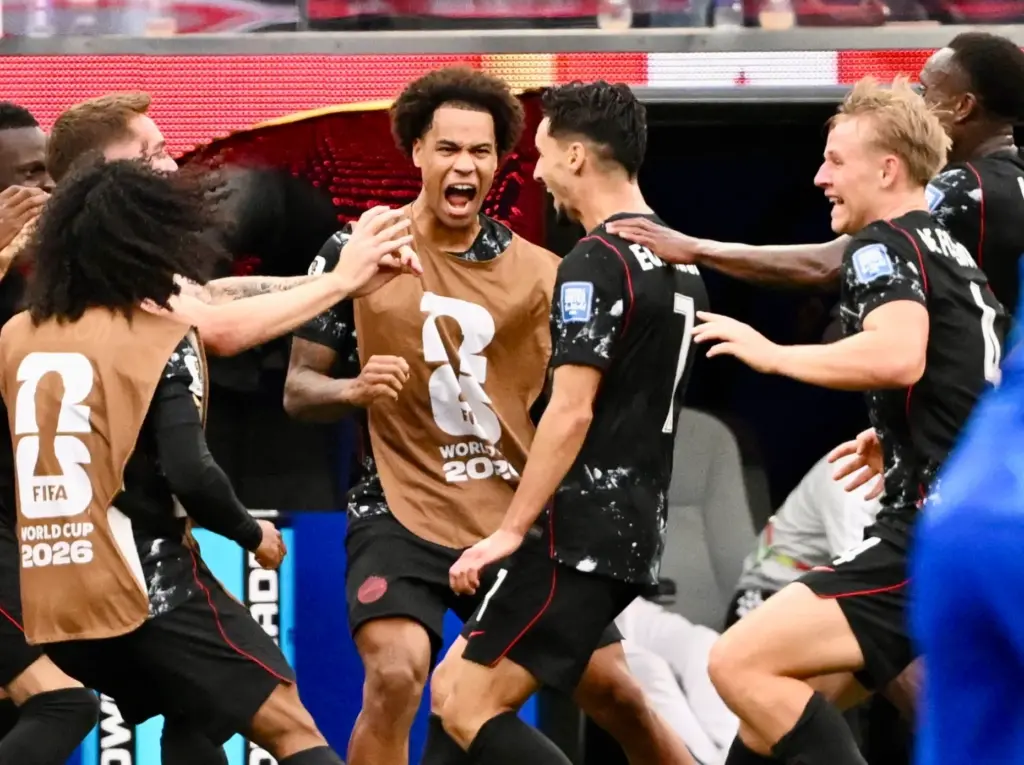 Canada midfielder Stephen Eustaquio (7) celebrates with teammates after scoring...