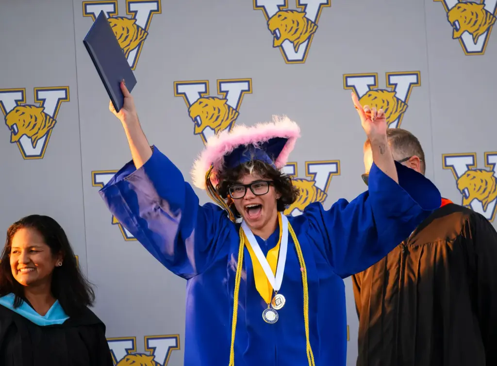 A graduate show his joy after receiving his diploma at...