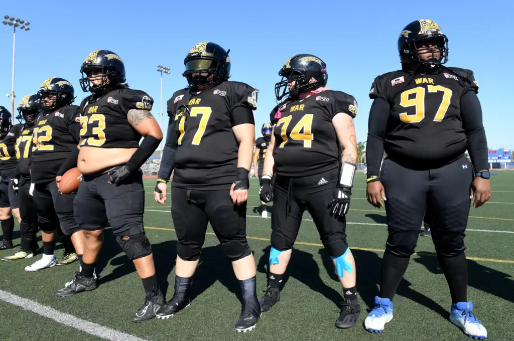 The Cali War offense lines up during practice before a...