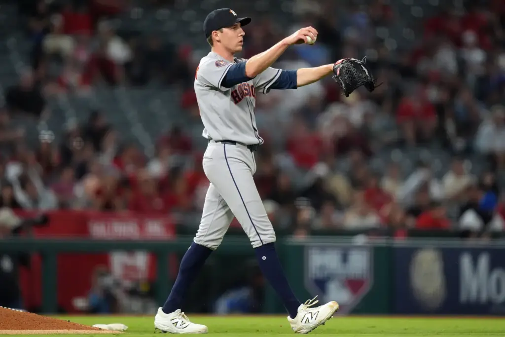 Houston Astros relief pitcher AJ Blubaugh walks behind the mound...