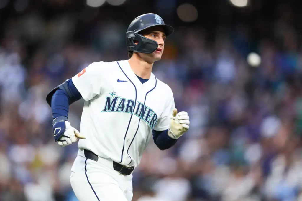 The Seattle Mariners’ Cole Young runs the bases after hitting...