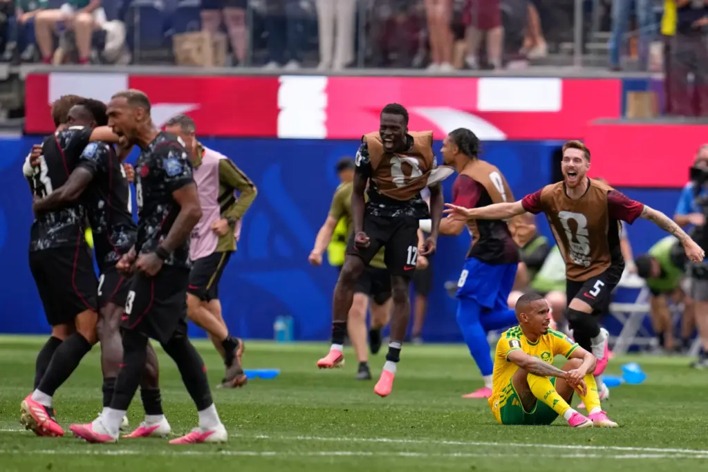 Canada’s players react at the end of the World Cup...