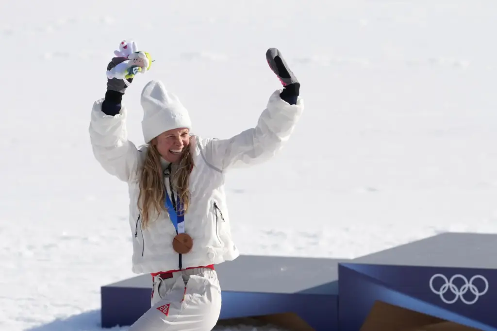 FILE – Jessie Diggins, of the United States, waves to...
