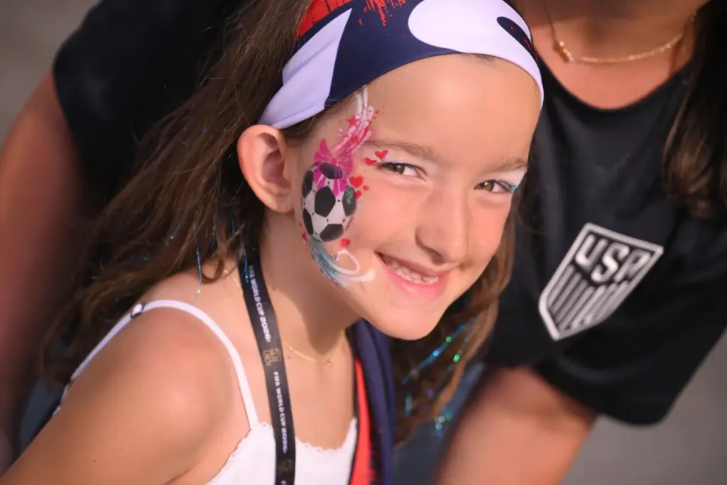 A young United States soccer fan shows off for temporary...