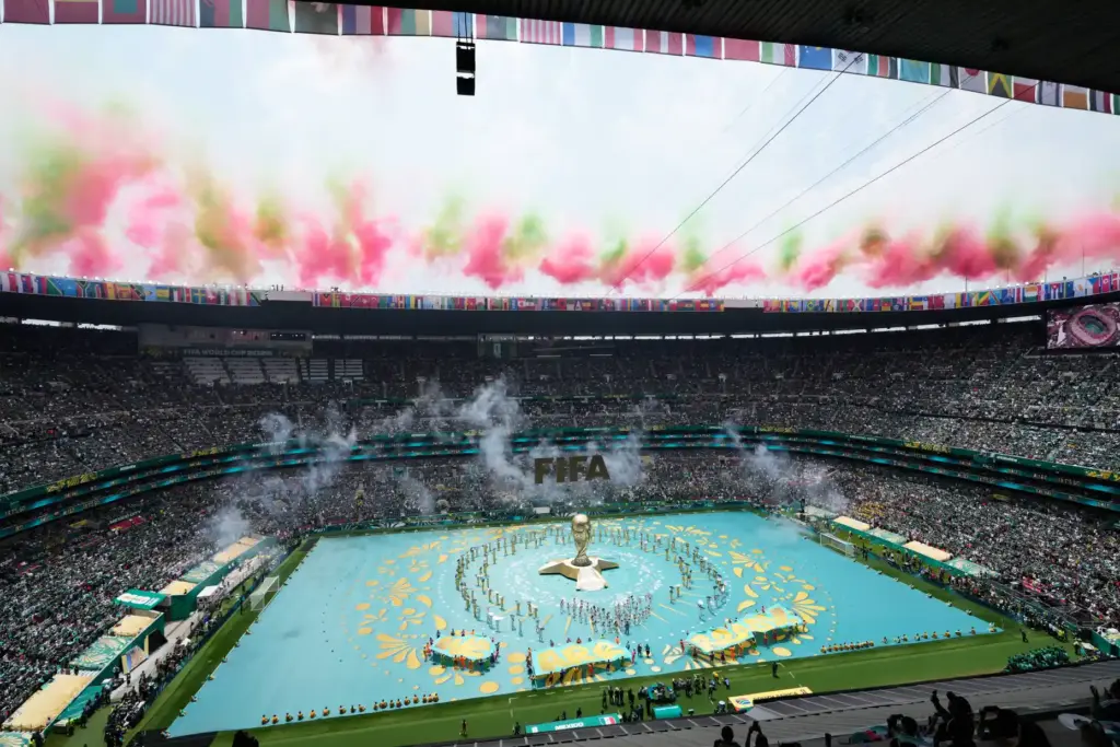 Performers on the pitch during the opening ceremony before the...