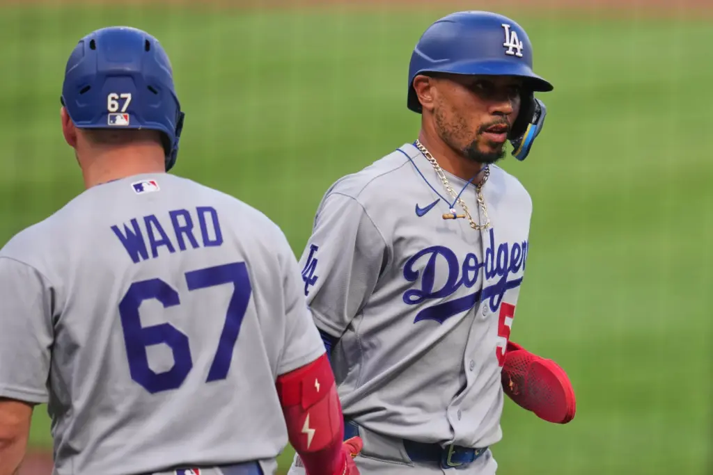 The Dodgers’ Mookie Betts, right, is greeted by teammate Ryan...