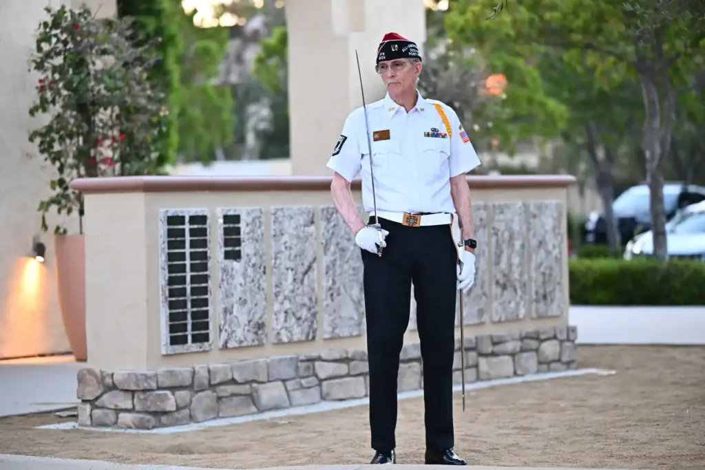 A member of the honor guard stands in front of...