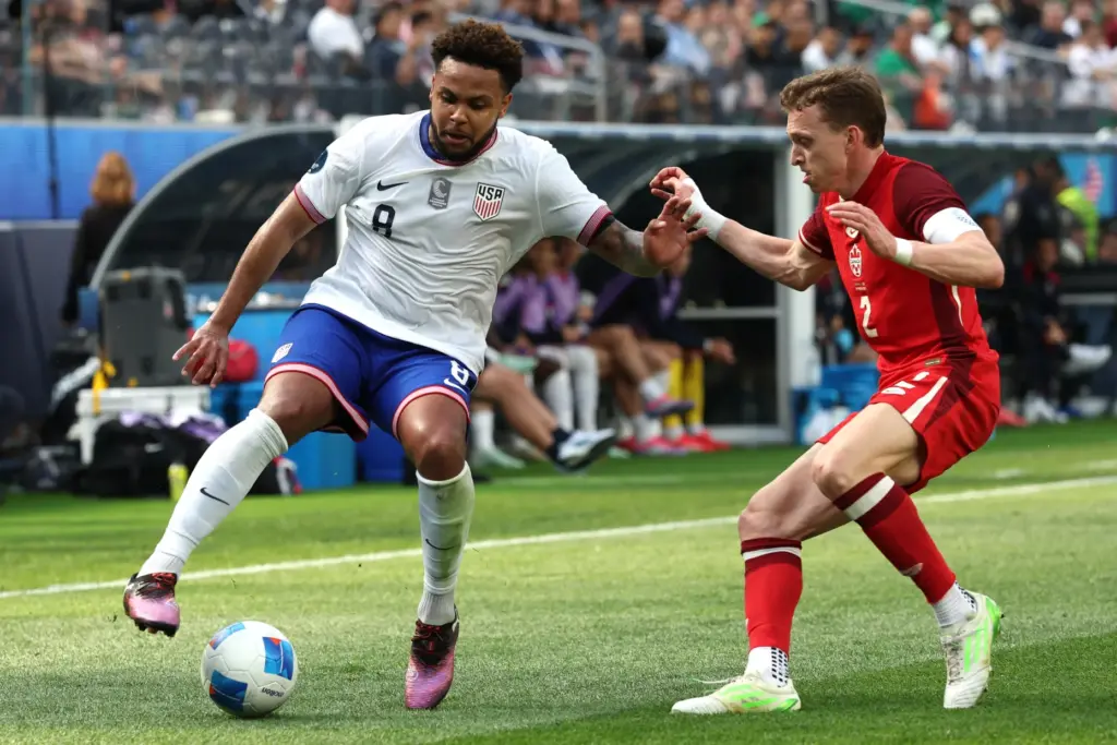 United States midfielder Weston McKennie recovers the ball defended by...