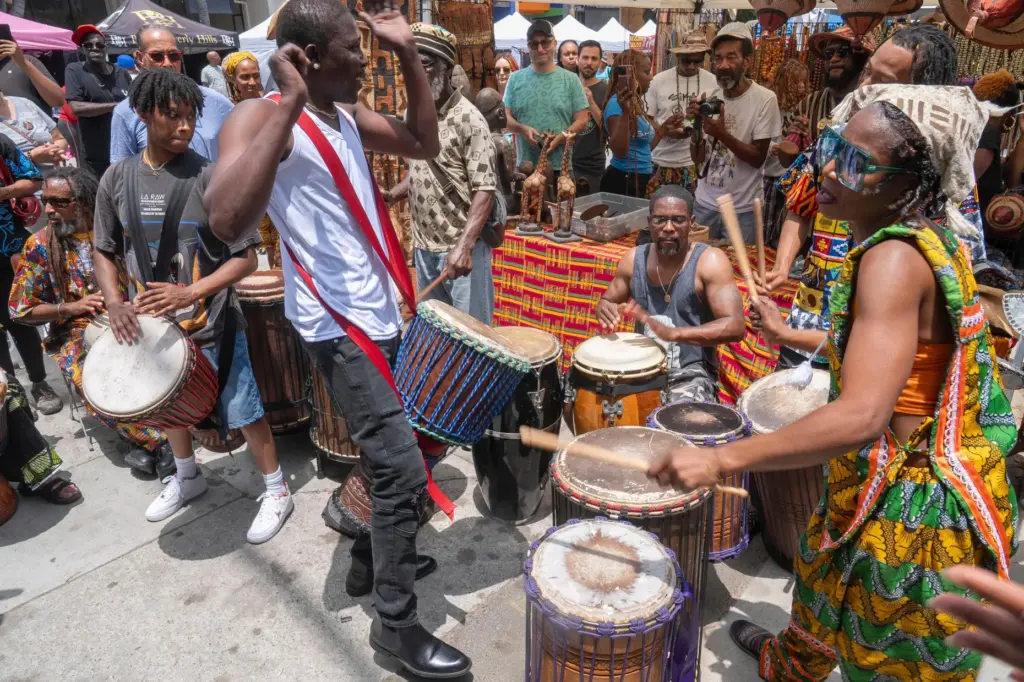 FILE – Drummers form a circle around Sika Dwimfo, better...