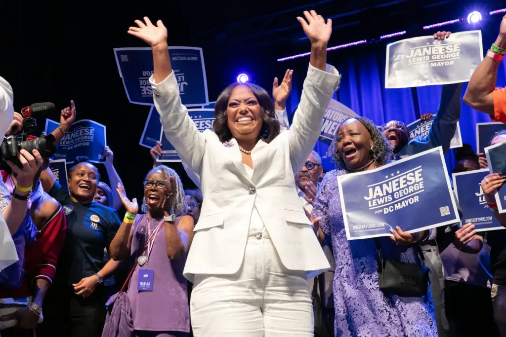 D.C. Council member Janeese Lewis George waves to the crowd...