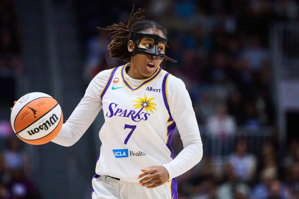The Sparks’ Ariel Atkins handles the ball during the second...
