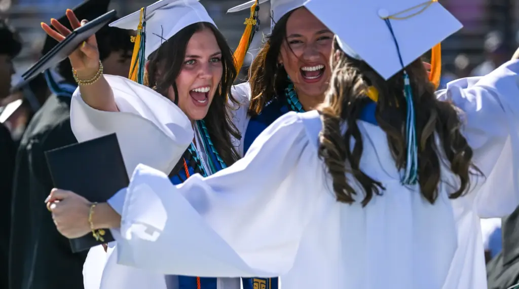 Graduates Kayana Coachman, Claire Fincher and Gabriella Tamraz celebrate after...