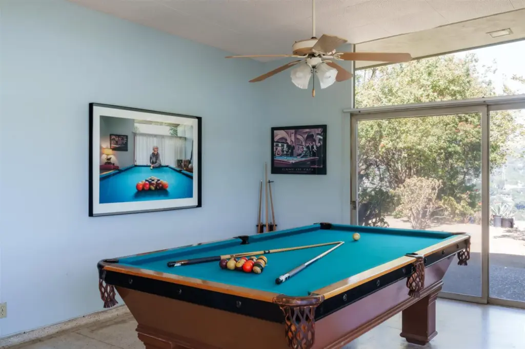 A picture of Betty Oliver playing pool graces the billiard...