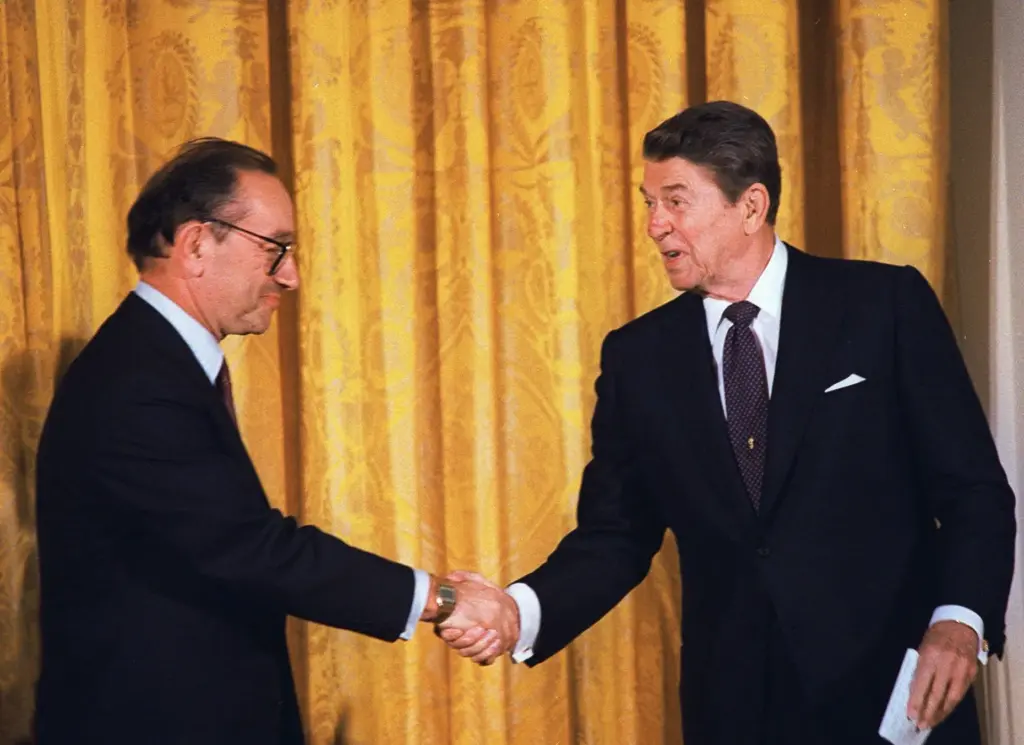 President Reagan congratulates Alan Greenspan after he was sworn in.