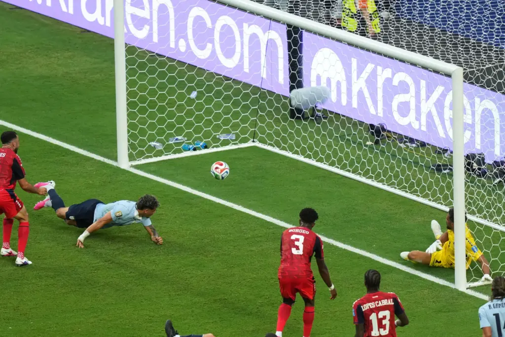 Uruguay’s Maxi Araujo, (20) scores his side’s opening goal during...