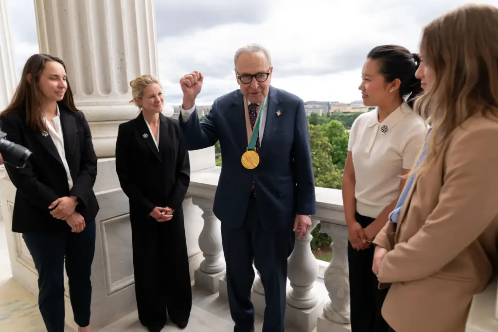 Senate Minority Leader Chuck Schumer, D-N.Y., speaks with Olympians Julia...