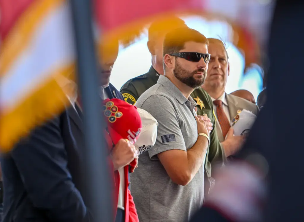 Retired Marine Scott Nokes attends a ceremony for a piece...