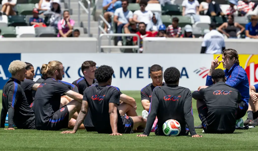 U.S. Menâs National Team head coach Mauricio Pochettino talks to...