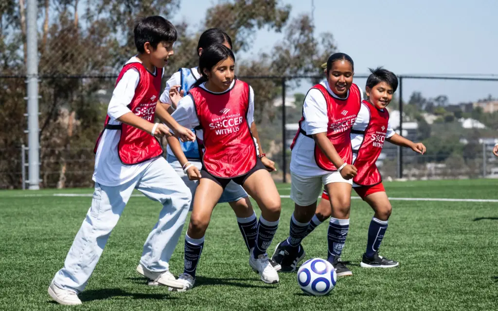 Kids play a game during a soccer clinic at Saddleback...