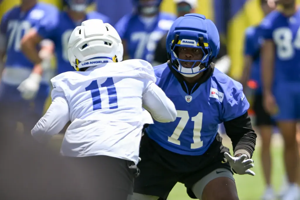 Rams offensive lineman Warren McClendon, Jr. (71) goes through drills...